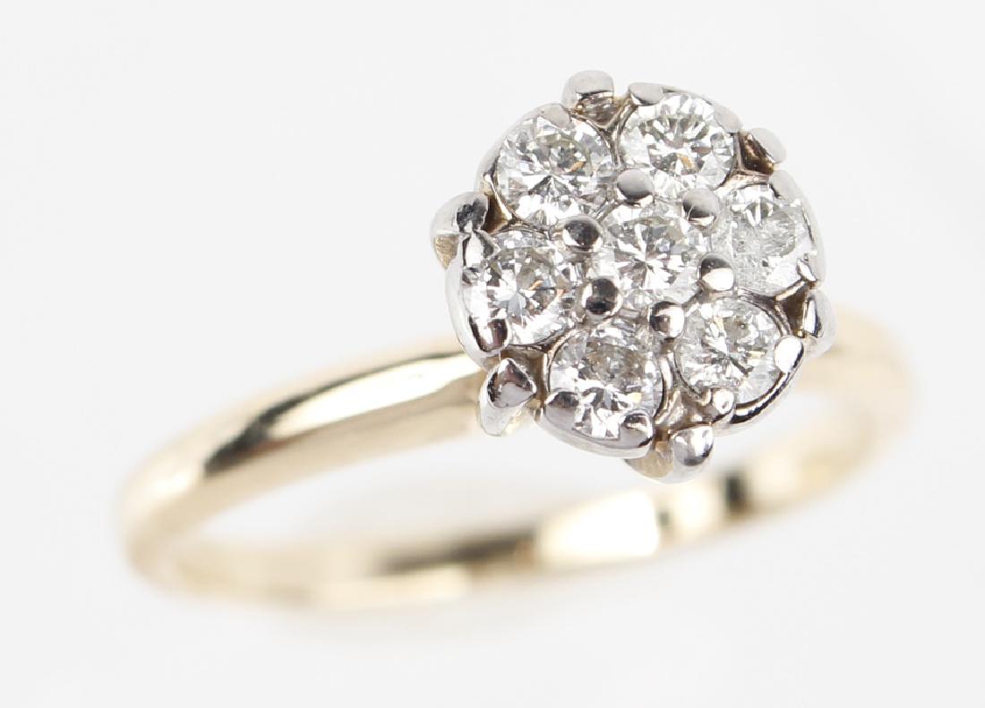LADIES 14K ANTIQUE DIAMOND ENGAGEMENT RING: LADIES 14K ANTIQUE DIAMOND ENGAGEMENT RING Ladies antique 14k yellow gold diamond cluster engagement ring. (7) .03ct round HI color VS1 to SI1 clarity diamonds. Prong set in white gold. Weight: 2.8 g 