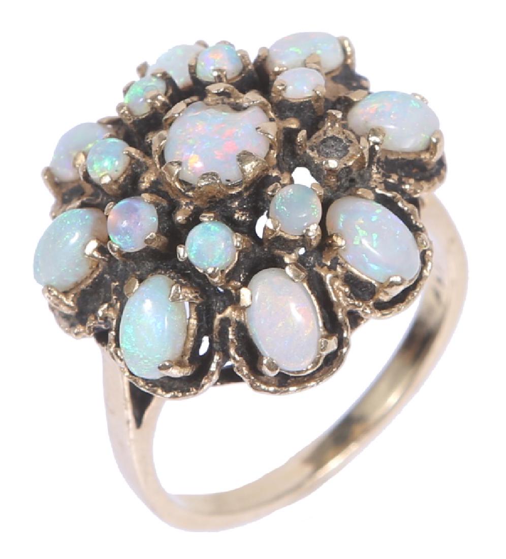 LADIES 14K YELLOW GOLD OPAL COCKTAIL RING: LADIES 14K YELLOW GOLD OPAL COCKTAIL RING Ladies antique 14k yellow gold cocktail ring, eight 5x2mm opals, seven 2mm round opals, and a 5mm round opal. Weight: 7.3 grams Size: 7