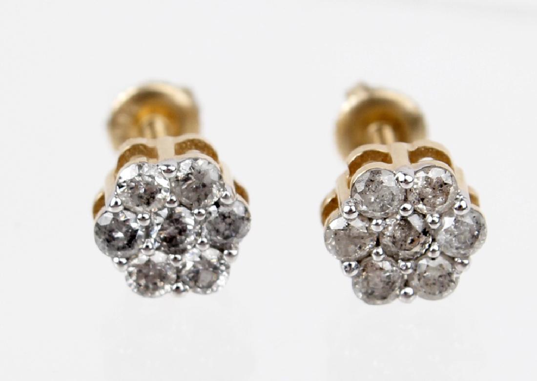 14K YELLOW GOLD DIAMOND EARRING STUDS: 14K YELLOW GOLD DIAMOND EARRING STUDS Ladies 14k yellow gold diamond cluster stud earrings. (14) .01ct round diamonds. .14cttw. Weight: 1.59 g