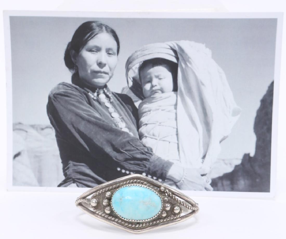 LADIES STERLING SILVER TURQUOISE BRACELET G. HENRY: LADIES STERLING SILVER TURQUOISE BRACELET G. HENRY Ladies Navajo sterling silver bracelet by Gary Henry, .75 x 1.00" oval blue turquoise. Accompanied by photograph and card of artist. Weight: 25.7 gra