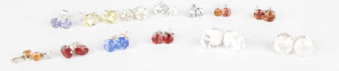 STERLING SILVER STUD EARRINGS - LOT OF 13: STERLING SILVER STUD EARRINGS - LOT OF 13 Dealer lot of 13 pairs of ladies stud earrings including garnet, CZ, labradorite, blue zircon, and more. Weight: 10.1 grams