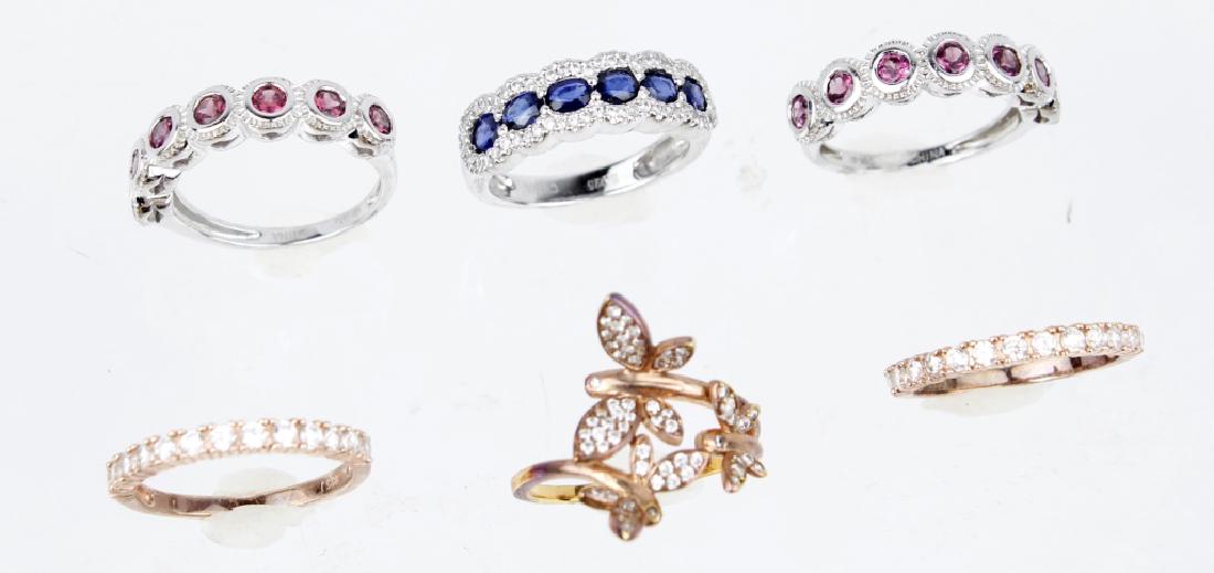 .925 STERLING SILVER STACKABLE RINGS - LOT OF 6: .925 STERLING SILVER STACKABLE RINGS - LOT OF 6 Lot of six .925 sterling silver stack able rings. (3) Rose gold over silver and (3) sterling with pink topaz and blue sapphire. Weight: 18.0 g Size: 7
