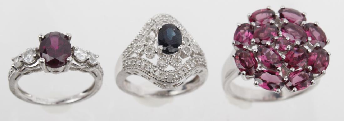 .925 STERLING SILVER FASHION RINGS - LOT OF 3: .925 STERLING SILVER FASHION RINGS - LOT OF 3 Lot of three Sterling silver fashion rings with enhanced rubies and sapphire. Weight: 12.6 g