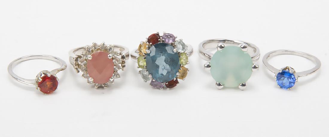 STERLING SILVER FASHION RINGS - LOT OF 5: STERLING SILVER FASHION RINGS - LOT OF 5 Lot of 5 Sterling silver women's fashion rings with Mandarin orange garnet, London blue topaz, citrine and others. Weight: 18.5 grams Size: 5