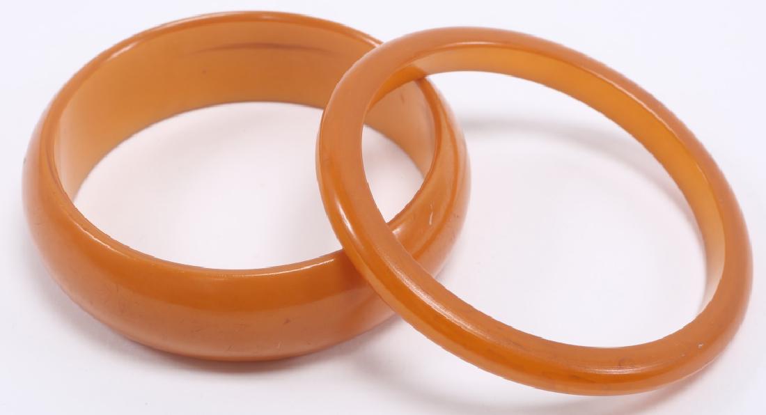 (2) VINTAGE BUTTERSCOTCH BAKELITE BANGLE BRACELETS: (2) VINTAGE BUTTERSCOTCH BAKELITE BANGLE BRACELETS Lot of two ladies bakelite bangle bracelets, one 5mm and one 20mm. Weight: 42.9 grams Size: 3.25"