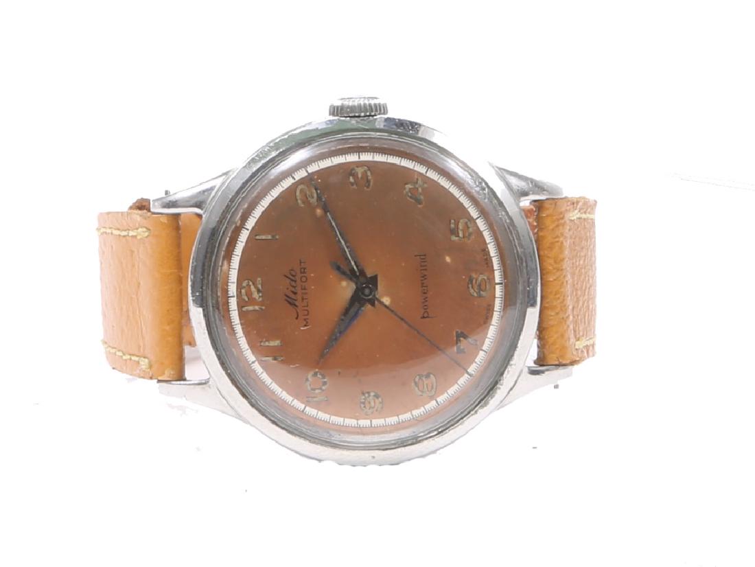 MEN`S STEEL MIDO MULTIFORT POWERWIND WATCH: MEN`S STEEL MIDO MULTIFORT POWERWIND WATCH Men's steel Swiss Mido Multifort wristwatch, burnt orange dial, automatic Powerwind movement. Weight: 33.6 grams Size: 32mm