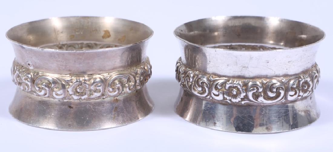 STERLING SILVER WALLACE FLORAL NAPKIN RING PAIR: STERLING SILVER WALLACE FLORAL NAPKIN RING PAIR Sterling silver Wallace floral napkin ring pair. Numbered "5623". Weight: 52 Grams Size: 2" Diameter