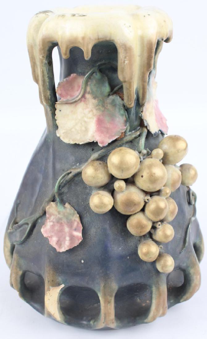 ART NOUVEAU STYLE AMPHORA POTTERY VASE: ART NOUVEAU STYLE AMPHORA POTTERY VASE Art nouveau style Amphora pottery vase with gilt grape design. Marked to the underside. Size: 8.75"