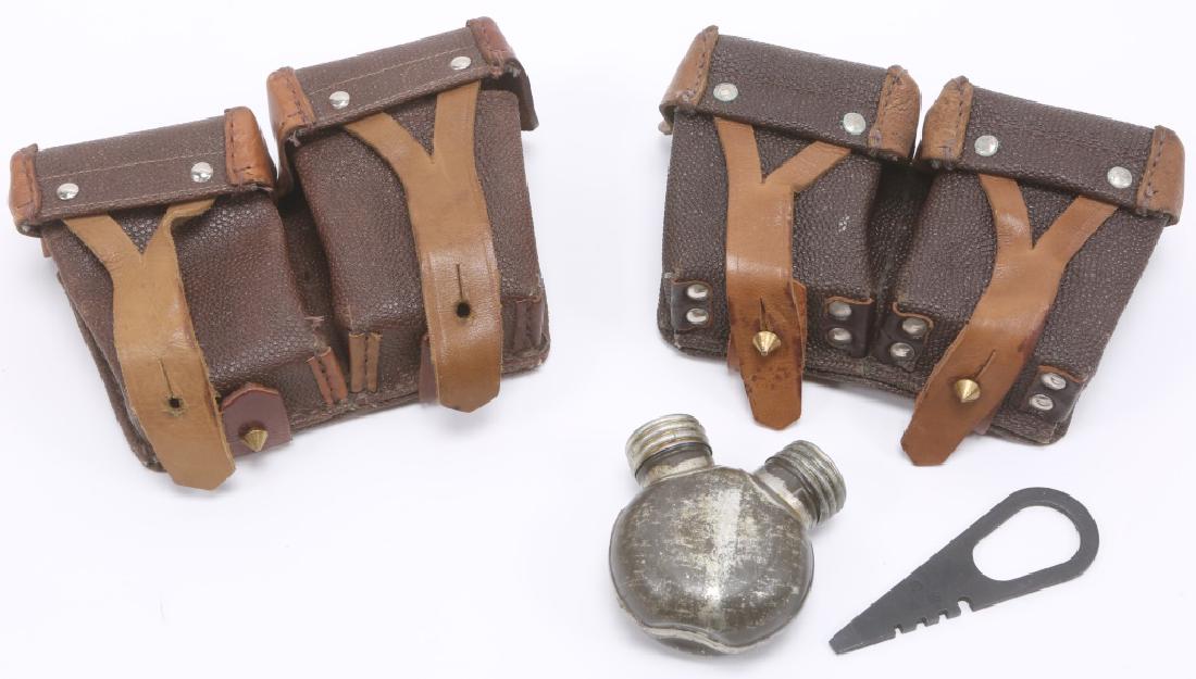 PAIR OF 1962 LEATHER MOSIN NAGANT CLEANING KITS: PAIR OF 1962 LEATHER MOSIN NAGANT CLEANING KITS Lot of two leather Mosin Nagant OTK cleaning kit pouches, one with oil and tool. Size: 7 x 4 x 2"