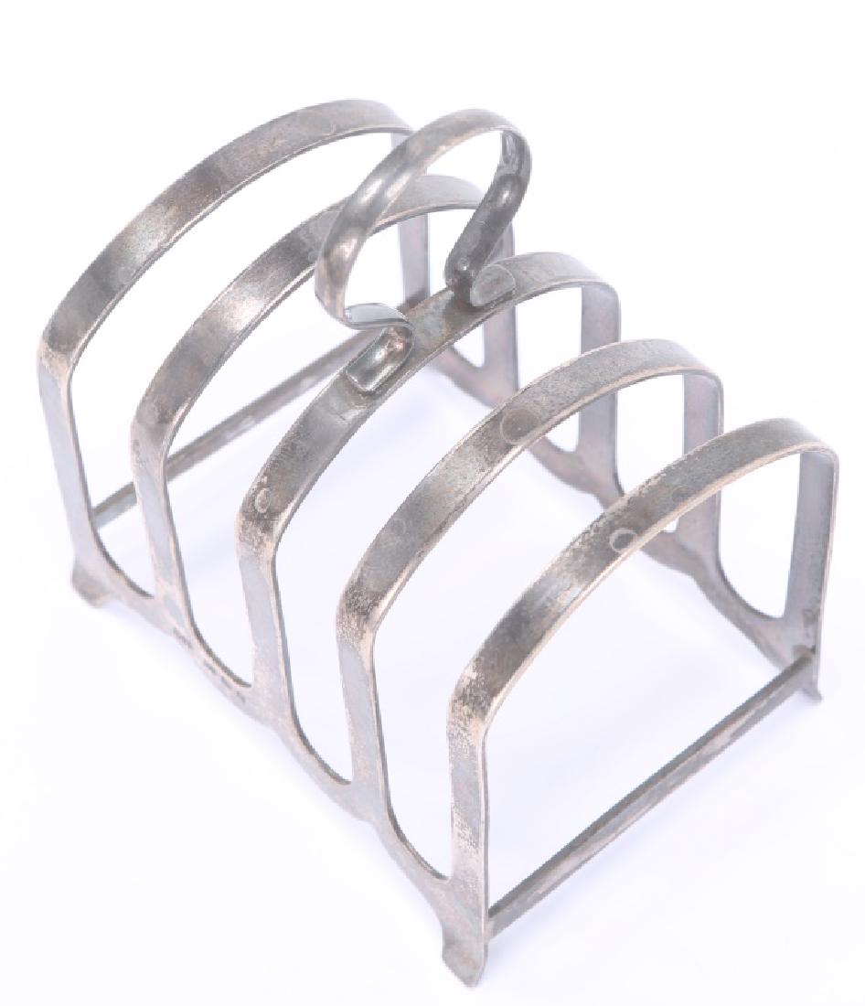 ROBERT PRINGLE & SONS STERLING NAPKIN HOLDER: ROBERT PRINGLE & SONS STERLING NAPKIN HOLDER Robert Pringle English sterling silver hallmarked napkin holder. Weight: 85.8 grams Size: 4.25 x 3.25 x 2.5"