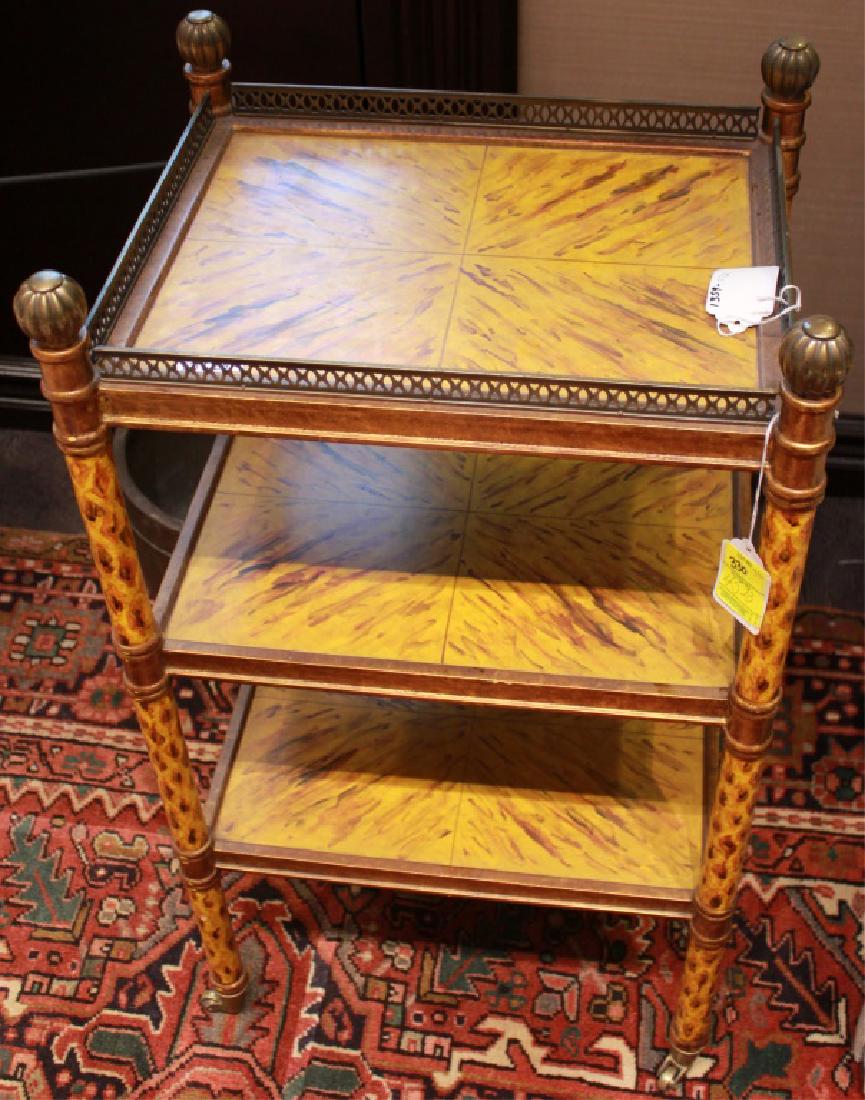 MID CENTURY ART DECO THREE SHELF BAR CART: MID CENTURY ART DECO THREE SHELF BAR CART Mid century bar cart in an art deco style with three shelves. Brass finishing, trim and finials. Painted wood shelves with orange yellow and cream detail. 36"