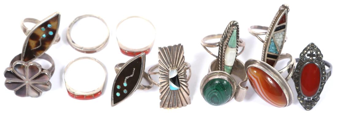 LADIES STERLING SILVER FASHION RINGS LOT OF 12: LADIES STERLING SILVER FASHION RINGS LOT OF 12 Mixed lot of ladies sterling silver rings, featuring turquoise, mother of pearl, malachite, red coral, and onyx. Weight: 51.6 grams