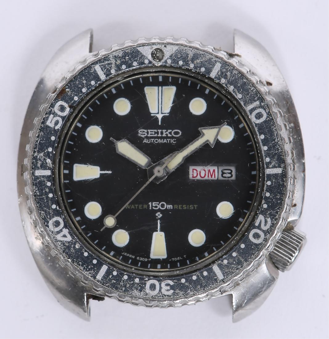 SEIKO AUTOMATIC DIVER STEEL WRISTWATCH 6309-7049: SEIKO AUTOMATIC DIVER STEEL WRISTWATCH 6309-7049 Seiko Automatic Water Resistant 150M steel case faded "ghost" bezel day date "Turtle" watch head, reference 6309-7049. Weight: 82.3 grams Size: 45mm