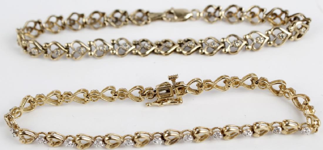 10K YELLOW GOLD HEART LINK BRACELETS - LOT OF 2: 10K YELLOW GOLD HEART LINK BRACELETS - LOT OF 2 10k yellow gold heart link bracelet lot of two. Heart links with diamond accents. (1) 0.12 cttw diamond accents, (1) solid gold with white gold accents.