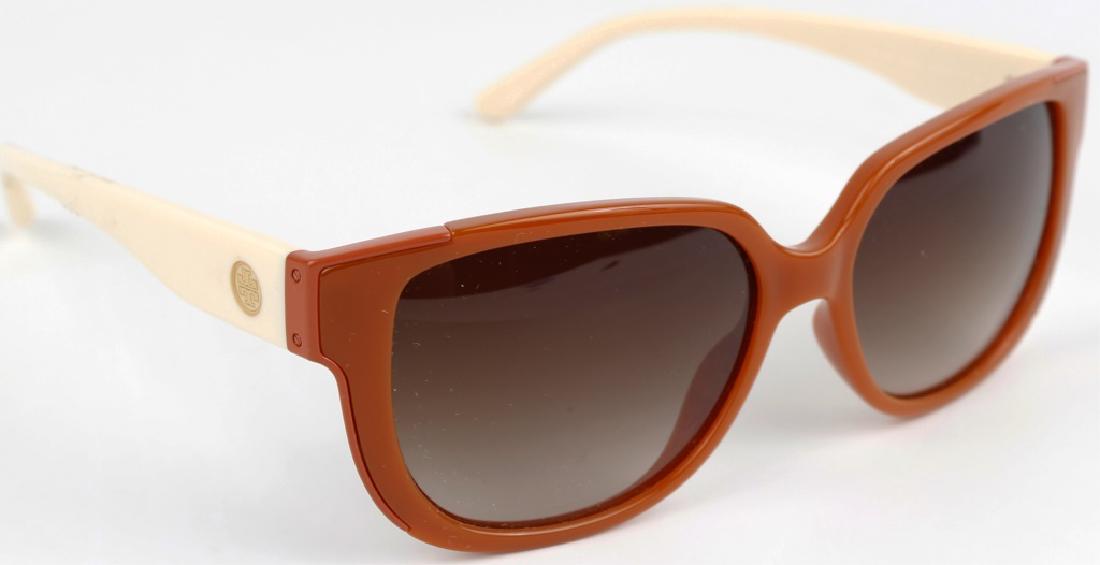 TORY BURCH ORANGE CREAM LADIES DESIGNER SUNGLASSES: TORY BURCH ORANGE CREAM LADIES DESIGNER SUNGLASSES Tory Burch ladies designer sunglasses in orange and cream color. Style number 9023.