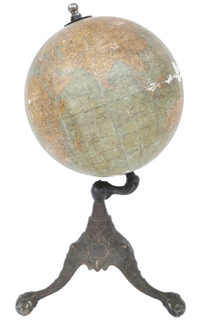 RAND MCNALLY 8" GLOBE WITH BRASS IRON CLAW BASE: RAND MCNALLY 8" GLOBE WITH BRASS IRON CLAW BASE Rand McNally 8" terrestrial globe with a brass and iron dragon claw base. Size: 15.5"