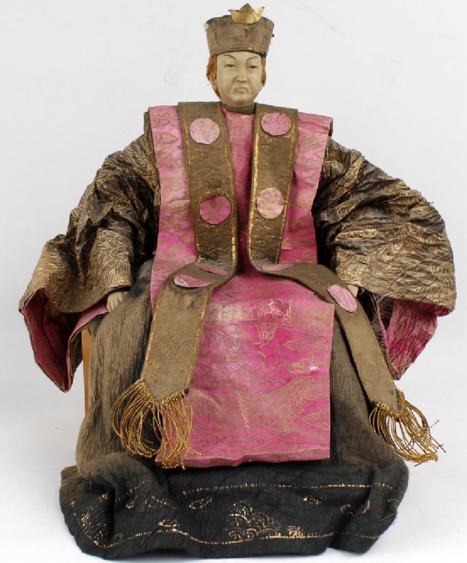 RARE ANTIQUE CHINESE PAPER DOLL: RARE ANTIQUE CHINESE PAPER DOLL Antique Chinese paper doll with stand. The face and hands made of plastic with pink and black paper clothing. Paper is thick and hand crafted aged. Gold detail. 14" x 1