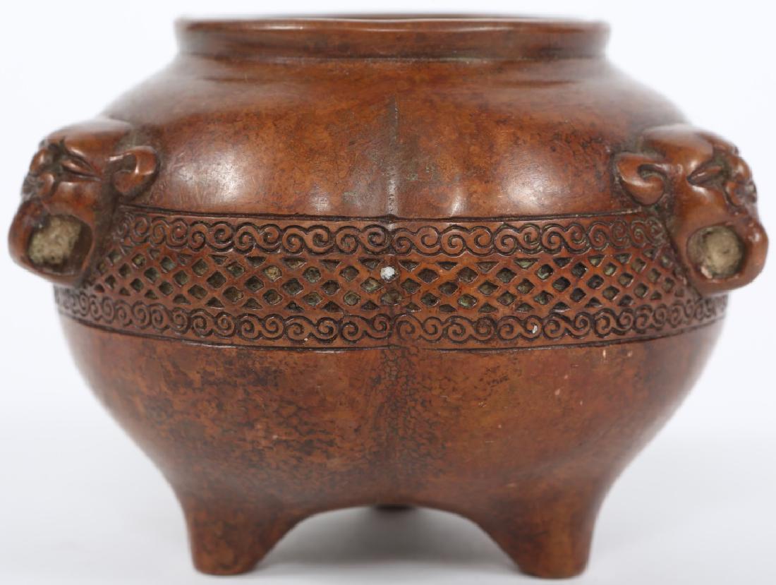 CHINESE COPPER TRIPOD PLUM VASE: CHINESE COPPER TRIPOD PLUM VASE Copper cast plum shaped miniature vase / pot, foo lion motif, stamped on underside. Size: 3" tall, 4" round