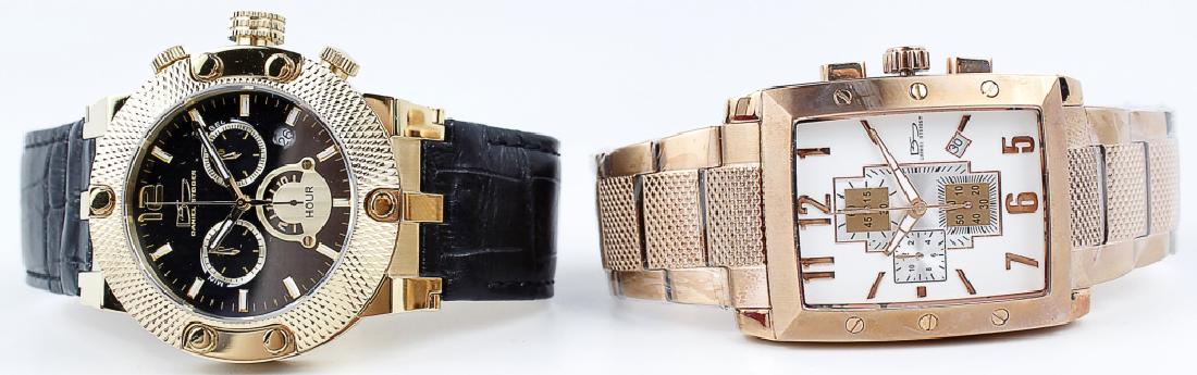 NIB DANIEL STEIGER WRISTWATCHES - LOT OF 2: NIB DANIEL STEIGER WRISTWATCHES - LOT OF 2 Lot of two Daniel Steiger men's chronograph wristwatches, one white dial rose gold tone 589 and one gold tone on leather 3108M.