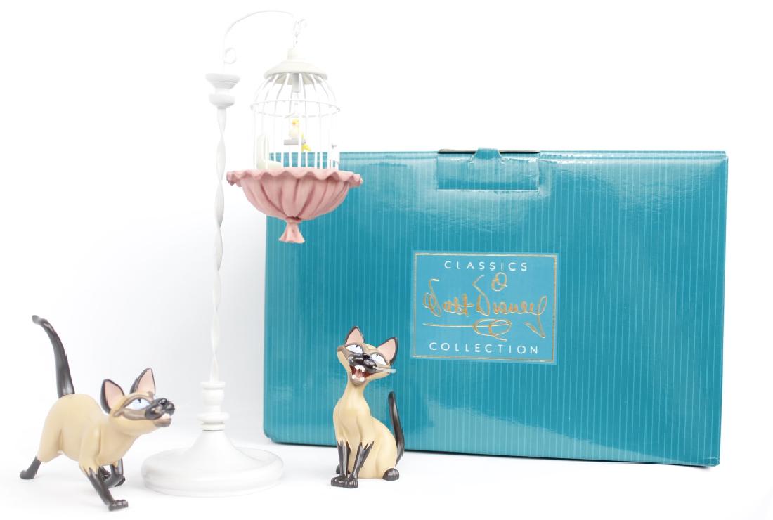 CLASSIC WALT DISNEY COLLECTION - LADY & THE TRAMP: CLASSIC WALT DISNEY COLLECTION - LADY & THE TRAMP Walt Disney's Classic Collection figurines. From Lady and the Tramp, titled "We are Siamese if You Please." Si and Am and a Birdcage. Marked with the 