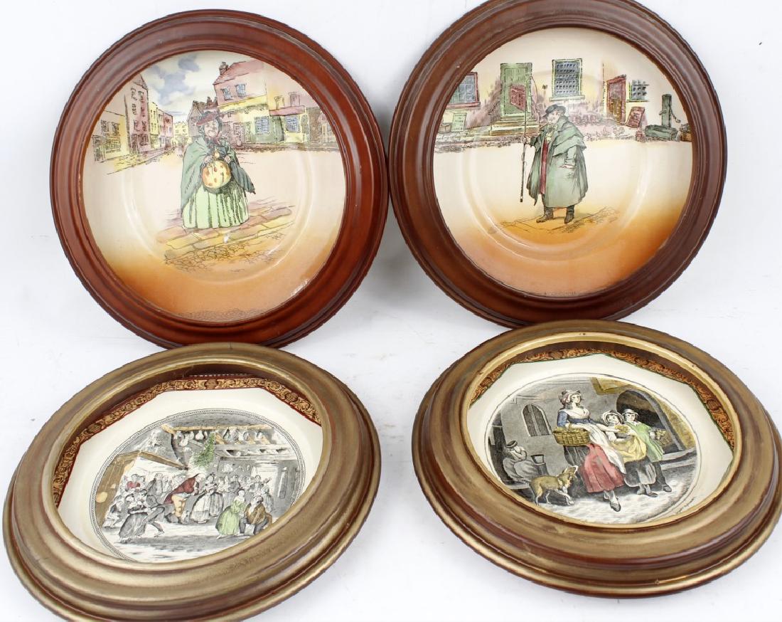 HANGING WALL PLATES LOT OF FOUR: HANGING WALL PLATES LOT OF FOUR Lot of four framed hanging wall plates to include: (2) Royal Dalton Dickens ware, (2) Adams England Christmas plates.