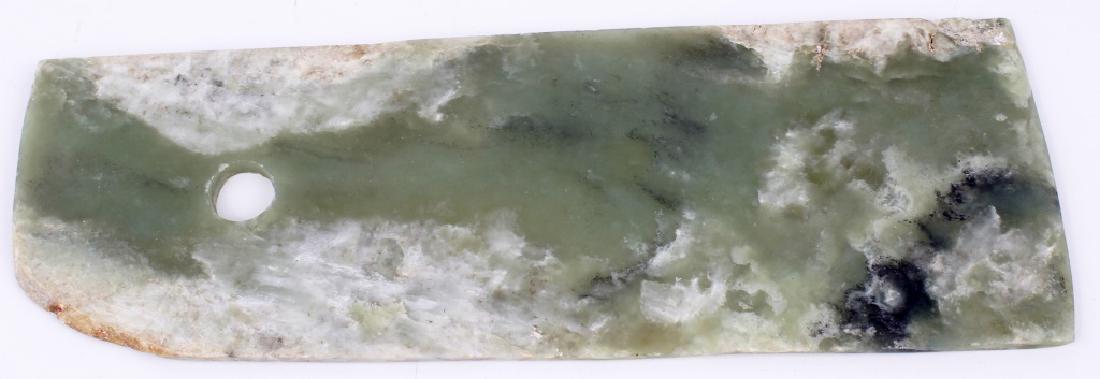 HAND CARVED NEPHRITE JADE AXE BLADE: HAND CARVED NEPHRITE JADE AXE BLADE Hand carved light green nephrite jade axe blade measuring 10.5" x 3.75"
