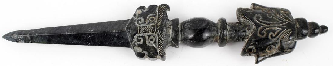 BLACK CHINESE JADEITE HAND CARVED DAGGER: BLACK CHINESE JADEITE HAND CARVED DAGGER Black jadeite hand carved dagger. Figural handle with a diamond tapered blade. Size: 9"