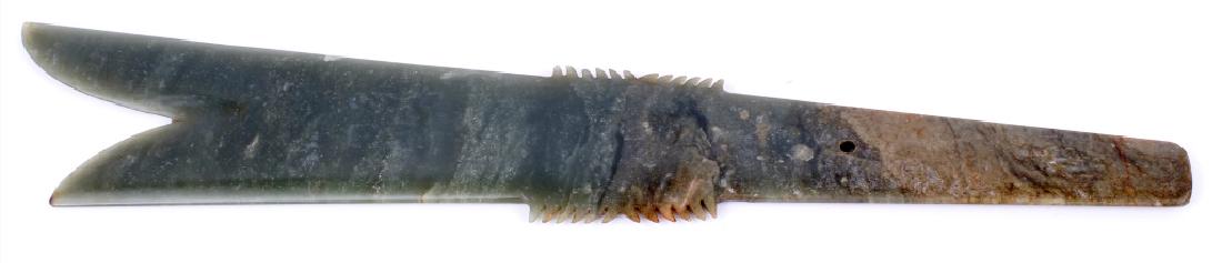 CHINESE NEPHRITE JADE HUNTING SPEAR HEAD: CHINESE NEPHRITE JADE HUNTING SPEAR HEAD Chinese nephrite jade decorative double edged hunting spear head with sharp points near the handle. Size: 13.25" x 2.25"