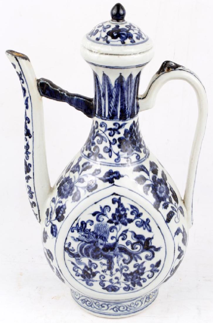 BLUE AND WHITE CERAMIC CHINESE WATER VESSEL: BLUE AND WHITE CERAMIC CHINESE WATER VESSEL Antique blue and white ceramic Chinese water kettle. Earthenware with and painted blue floral detail glaze on a white base. Measures 15.5" Size: 15.5" H x 9