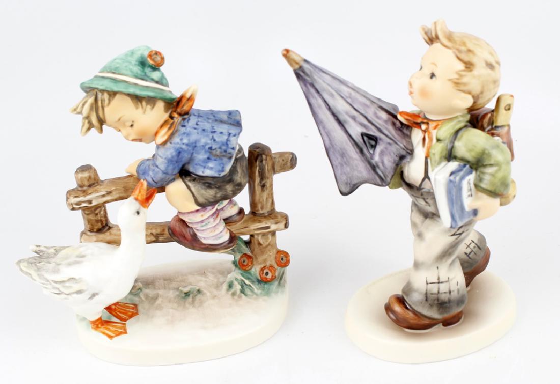 GOEBEL HUMMEL PORCELAIN FIGURINES - LOT OF 2: GOEBEL HUMMEL PORCELAIN FIGURINES - LOT OF 2 Lot of two Goebel Hummel figurines in original boxes to include: Is It raining? #268 and Barnyard Hero #843. Size: 6 1/8" largest