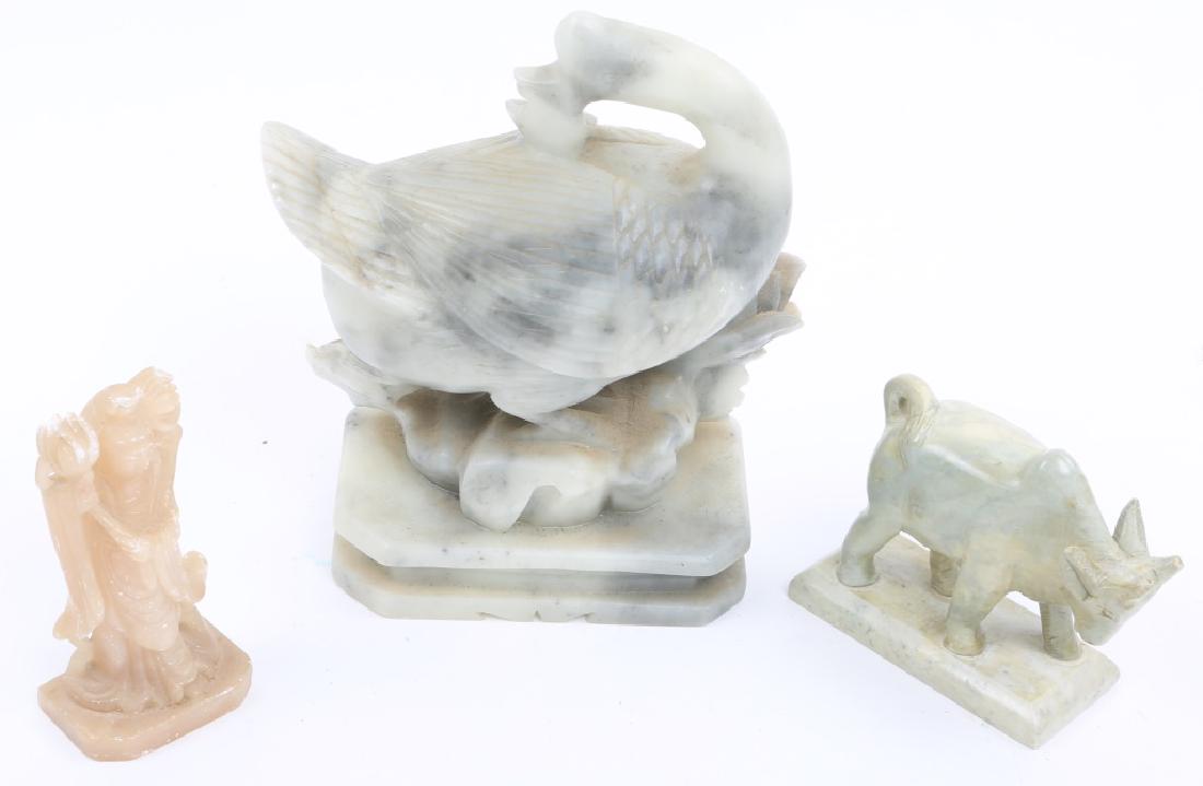 CHINESE CARVED SOFTSTONE FIGURINES - LOT OF 3: CHINESE CARVED SOFTSTONE FIGURINES - LOT OF 3 Lot of three Chinese carved softstone items, to include one bull, one guanyin statue, and one goose. Size: 3 to 7" Tall