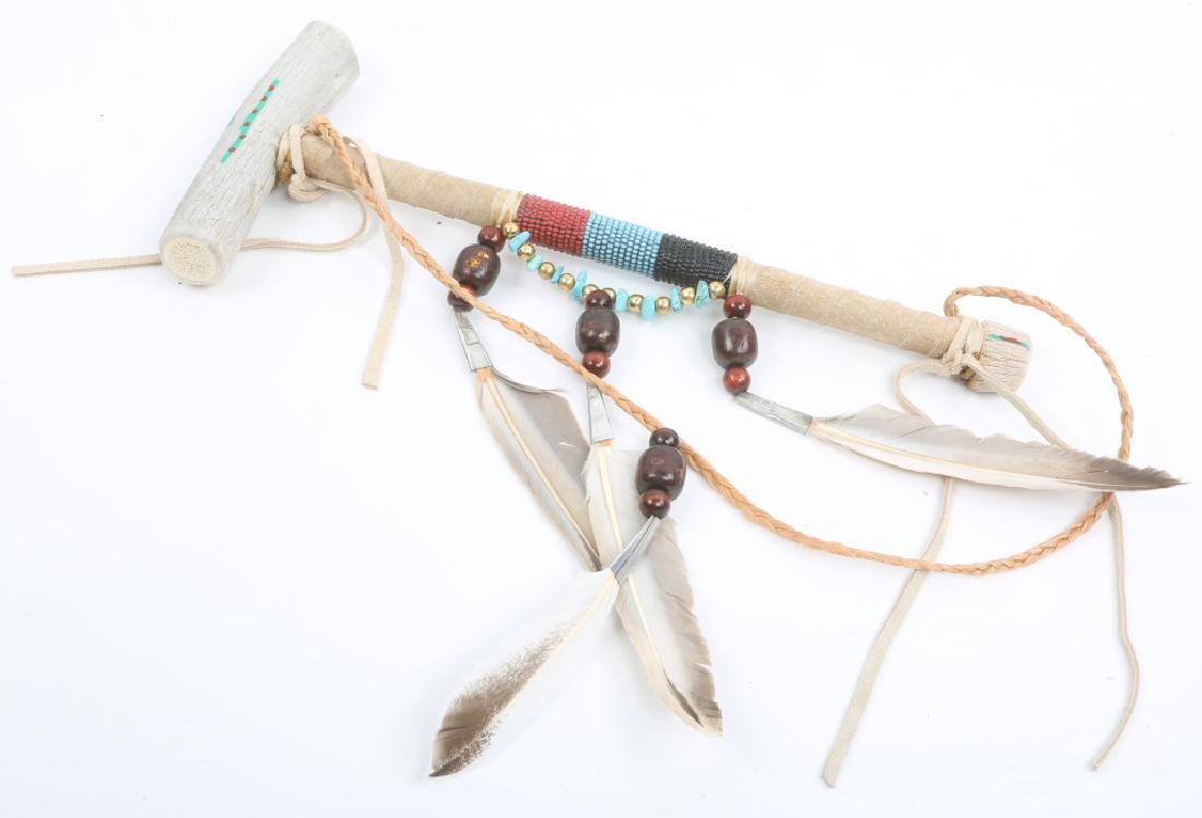 NATIVE AMERICAN BONE TURQUOISE PEYOTE STICK: NATIVE AMERICAN BONE TURQUOISE PEYOTE STICK Navajo Peyote rattle with bone, feather, turquoise, and beaded accents. Size: 12.25"
