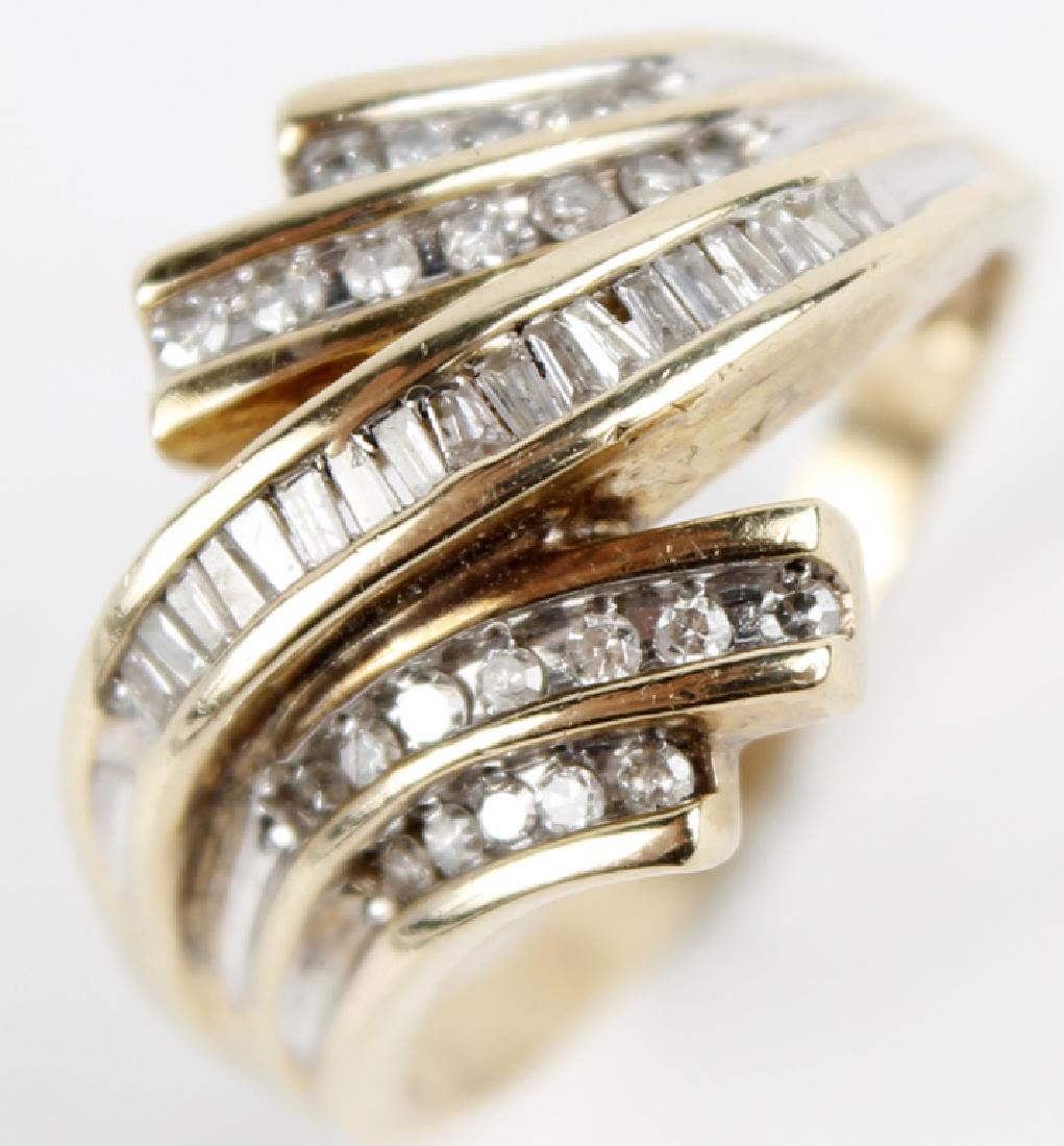 10K YELLOW GOLD DIAMOND LADIES RING: 10K YELLOW GOLD DIAMOND LADIES RING 10K yellow gold and diamond ladies fashion ring. Cascading rows of baguette and round diamonds totaling 0.43 ct. Stamped 10k. Weight: 5.0 g Size: 9