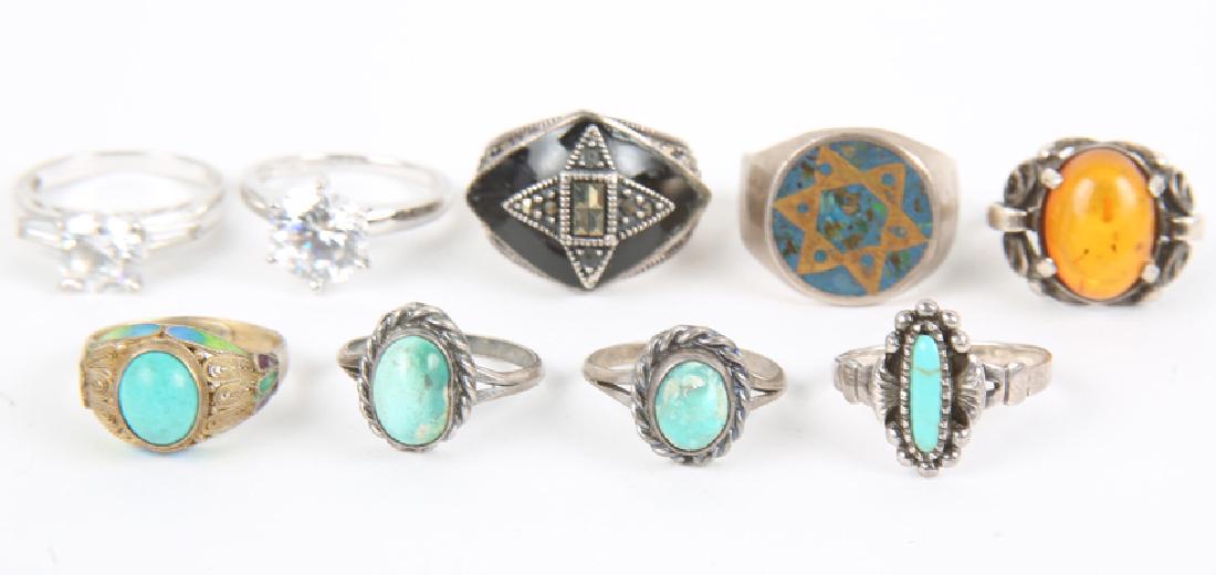 LADIES STERLING SILVER FASHION RINGS - LOT OF 9: LADIES STERLING SILVER FASHION RINGS - LOT OF 9 Lot of 9 ladies sterling silver rings, featuring turquoise, amber, CZ, marcasite, onyx, and enamel. Weight: 38.0 grams