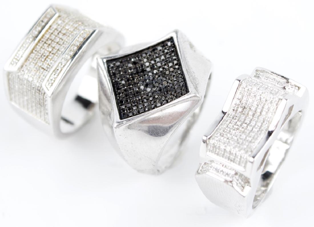 STERLING SILVER DIAMOND MEN'S FASHION RINGS - 3: STERLING SILVER DIAMOND MEN'S FASHION RINGS - 3 Lot of three .925 sterling silver diamond men's rings. 0.26ct per ring with (2) micro pave white diamonds and (1) micro pave black diamonds. Weight: 20.