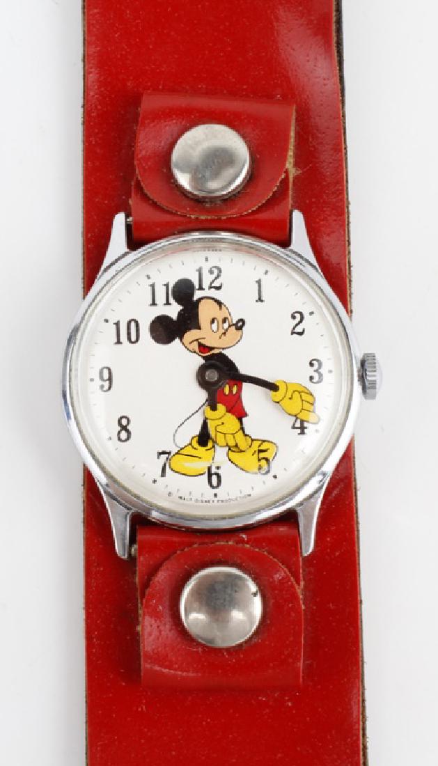 INGERSOLL YELLOW GLOVE MICKEY MOUSE WRISTWATCH: INGERSOLL YELLOW GLOVE MICKEY MOUSE WRISTWATCH Collectible Ingersoll red leather band Mickey mouse with yellow gloves watch with spare American flag leather band in original box.