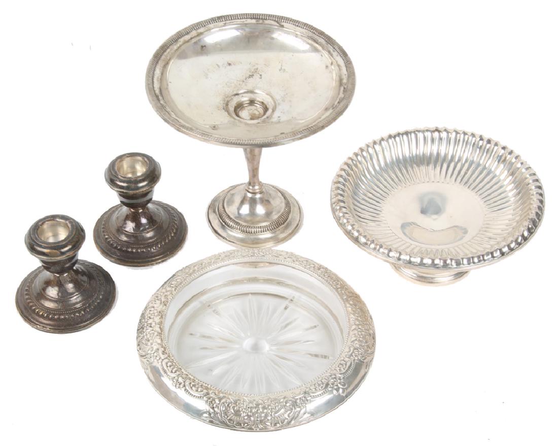 STERLING SILVER WEIGHTED ITEMS - LOT OF 5: STERLING SILVER WEIGHTED ITEMS - LOT OF 5 To include: pair of sterling Arrow Smith candlesticks, sterling scalloped dish, Watrous compote, and Frank Whiting wine coaster. Weight: 1486.6 grams
