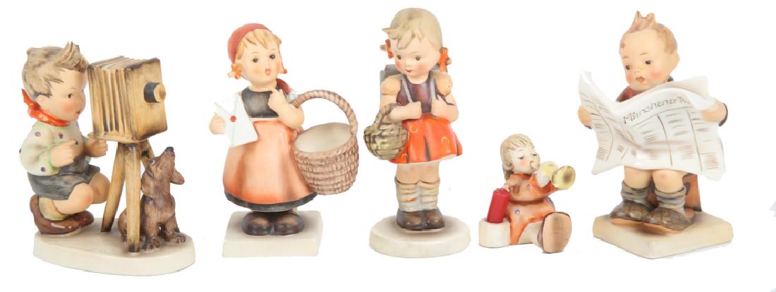 GOEBEL HUMMEL PORCELAIN FIGURINES - LOT OF 5: GOEBEL HUMMEL PORCELAIN FIGURINES - LOT OF 5 Lot of five German Goebel Hummel figurines, to include: 13/0 Meditation, 178 The Photographer, 184 Latest News, 84 School Girl, and Trumpet candle holder.