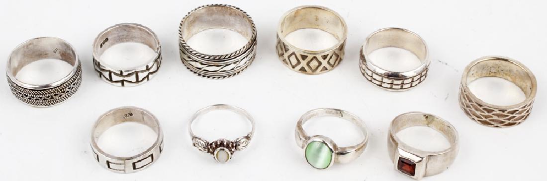 LOT OF 10 STERLING SILVER RINGS - ASSORTED: LOT OF 10 STERLING SILVER RINGS - ASSORTED Assorted dealers lot of 10 sterling silver .925 rings. Assorted sizes. Weight: 57 g