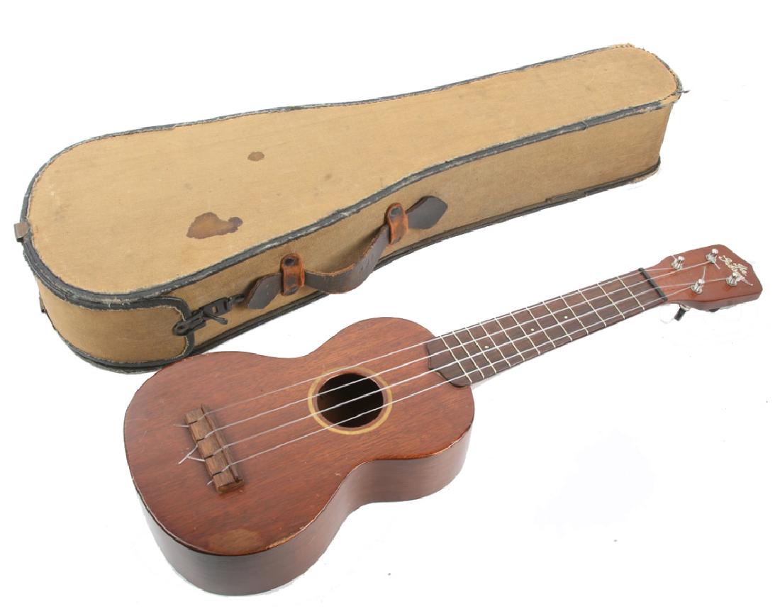 THE GIBSON MAHOGANY SOPRANO UKULELE: THE GIBSON MAHOGANY SOPRANO UKULELE Early 20th century Gibson mahogany wood soprano ukulele, 21 inches, accompanied by case.