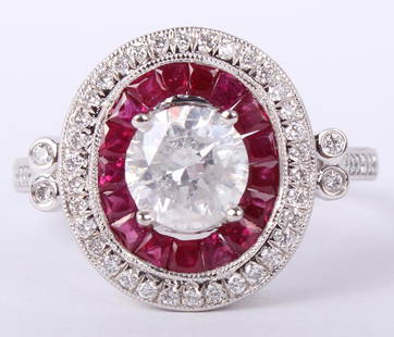 LADIES .950 PLATINUM RUBY & DIAMOND RING: LADIES .950 PLATINUM RUBY & DIAMOND RING Ladies .950 platinum custom made diamond and red ruby ring. Ring features a center round brilliant cut diamond of 1.04ct, F color and I1 clarity. Center stone