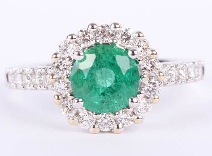 LADIES 18K WHITE GOLD EMERALD & DIAMOND RING: LADIES 18K WHITE GOLD EMERALD & DIAMOND RING Ladies 18k white gold custom made diamond and green emerald ring. Ring features a .91ct Natural Beryl brilliant crown cut emerald, accented by .49ctw in