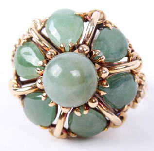 LADIES 14K YELLOW GOLD GREEN JADE DOME RING: LADIES 14K YELLOW GOLD GREEN JADE DOME RING Ladies 14k yellow gold and green jadeite ring. Features 6 pear cut jade accents around a single center round natural green jade center in dome setting.