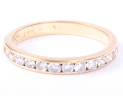 LADIES 14K YELLOW GOLD DIAMOND WEDDING BAND: LADIES 14K YELLOW GOLD DIAMOND WEDDING BAND Ladies 14k yellow gold diamond wedding band / ring featuring 13 channel set brilliant round white diamonds, approximately .33ctw. Weight: 1.8 grams Size: 5