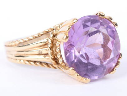 LADIES 14K YELLOW GOLD PURPLE AMETHYST RING: LADIES 14K YELLOW GOLD PURPLE AMETHYST RING Ladies 14k yellow gold and purple amethyst cocktail ring, 20mm round center stone in openwork setting. Weight: 8.6 grams Size: 8.5