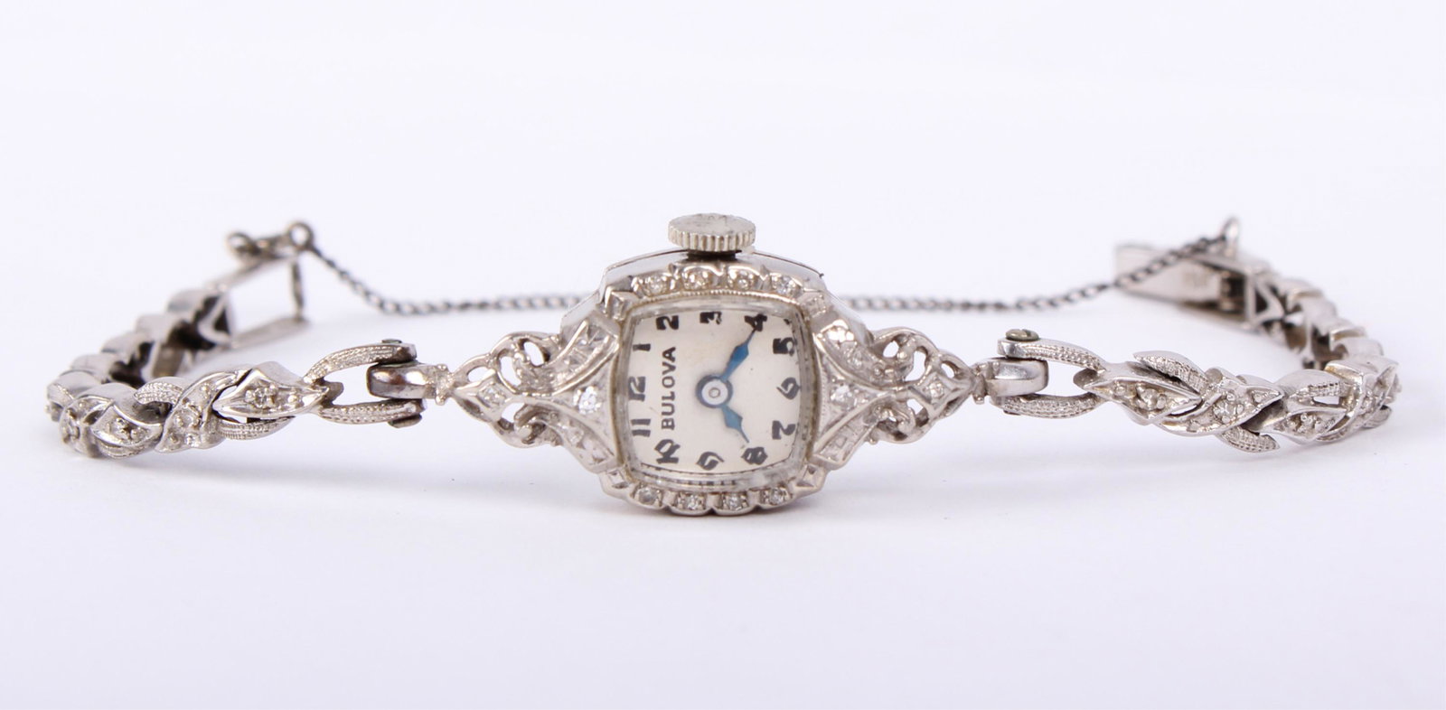 LADIES BULOVA 14K WHITE GOLD DIAMOND WRIST WATCH: LADIES BULOVA 14K WHITE GOLD DIAMOND WRIST WATCH Antique ladies solid 14k white gold diamond art deco wristwatch by Bulova. White dial with Arabic numerals, blued steel hands. Weight: 14.2 grams Size: