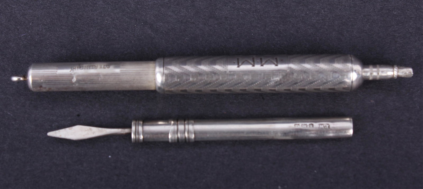 STERLING SILVER HALLMARKED TOOTHPICK & PEN: STERLING SILVER HALLMARKED TOOTHPICK & PEN Sterling silver English hallmarked propelling toothpick and Fairchild Sterling Chatelaine Propelling pen / pencil. Size: 3"