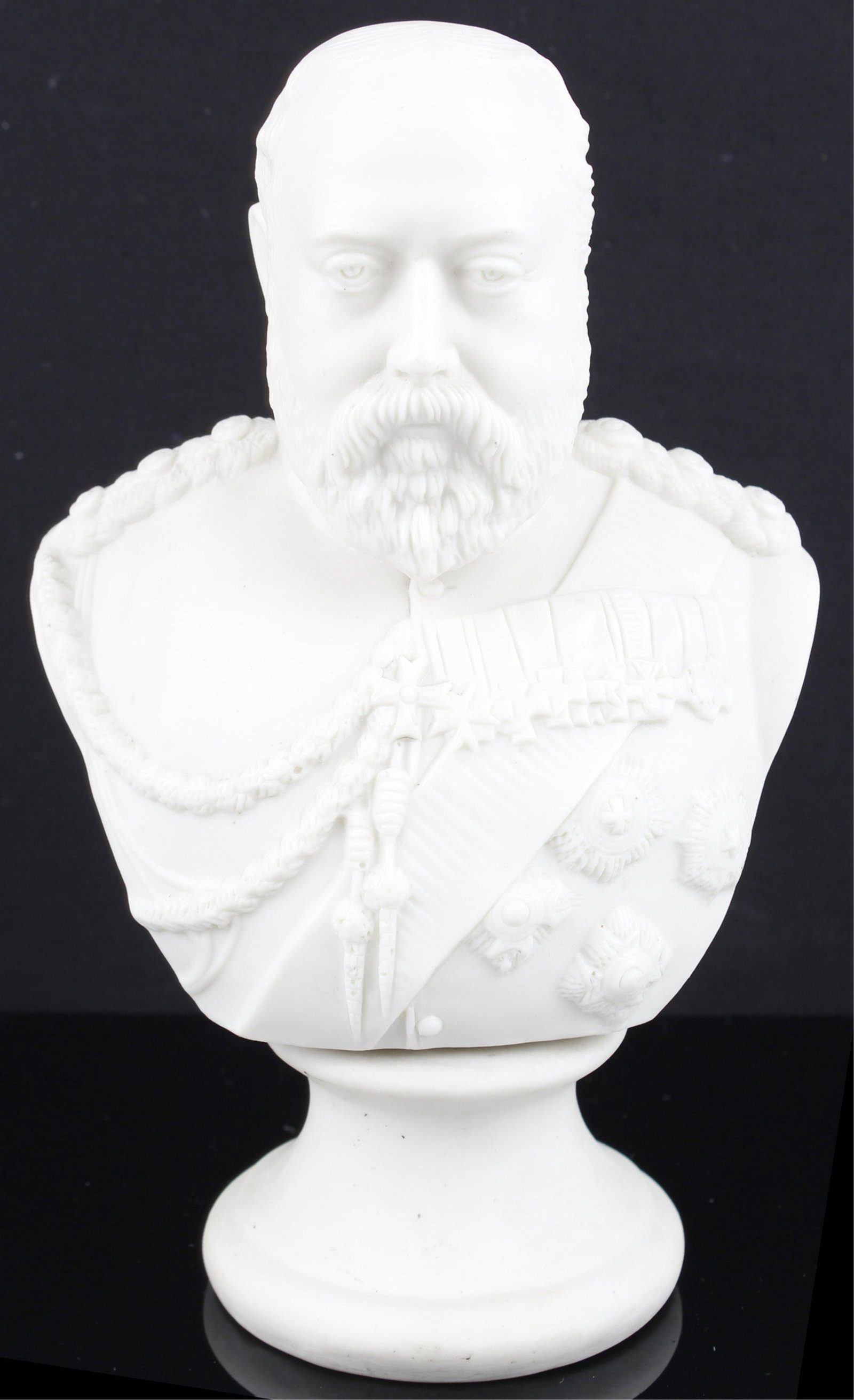 ROBINSON & LEADBEATER EDWARD VII PARIAN BUST: ROBINSON & LEADBEATER EDWARD VII PARIAN BUST A well detailed Parian bust of King Edward VII, c. 1902, in military uniform with medals displayed by Robinson & Leadbeater, mounted on a Parian socle. Exc