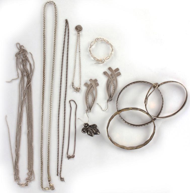 LADIES STERLING SILVER JEWELRY - 86.0 GRAMS: LADIES STERLING SILVER JEWELRY - 86.0 GRAMS To include three bangle bracelets, one pair of earrings, two chain bracelets, one three strand necklace (broken), one chain necklace (broken), two single ea