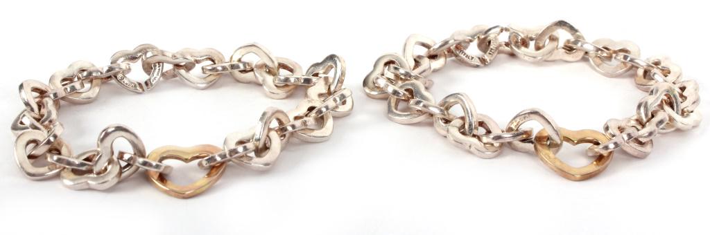 .925 AND 14K YELLOW GOLD HEART BRACLETS - LOT OF 2: .925 AND 14K YELLOW GOLD HEART BRACLETS - LOT OF 2 .925 and 14k yellow gold link bracelets with small sterling silver hearts with one larger 14k gold heart. Weight: 68.7 grams